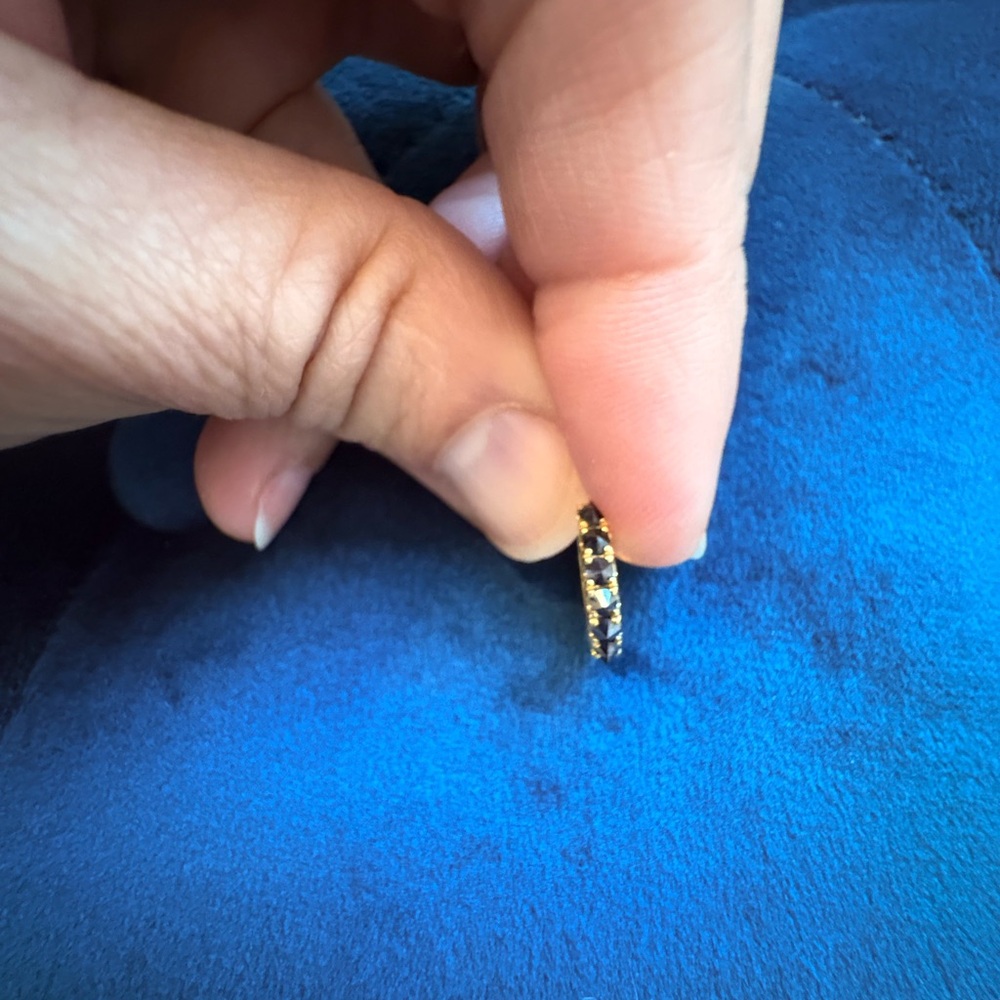 Maria Tash black diamond and gold 9.5mm hoop.